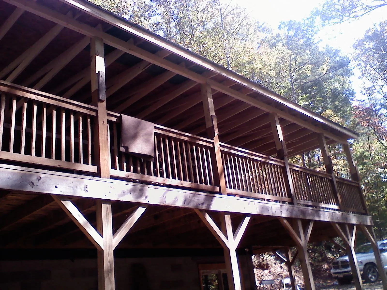 Timber framing under a new elevated porch and deck — Roof Leak Repair in West Roxbury by Roofing Brothers